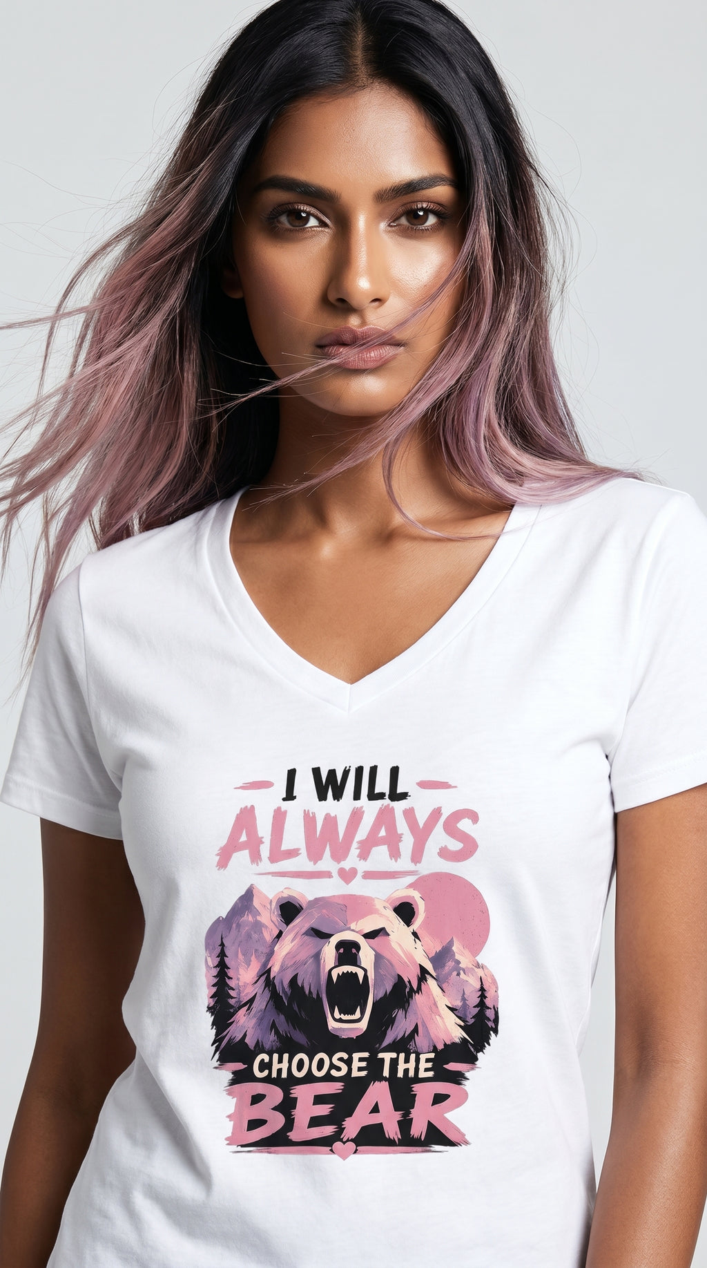 Woman wearing a white graphic t-shirt featuring a pink and purple bear design with the phrase "I Will Always Choose the Bear" against a mountain landscape backdrop.